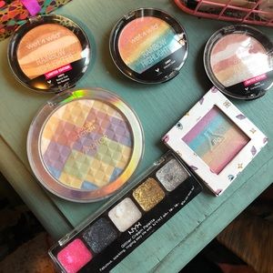 Makeup. Highlighters, lipsticks, he powders